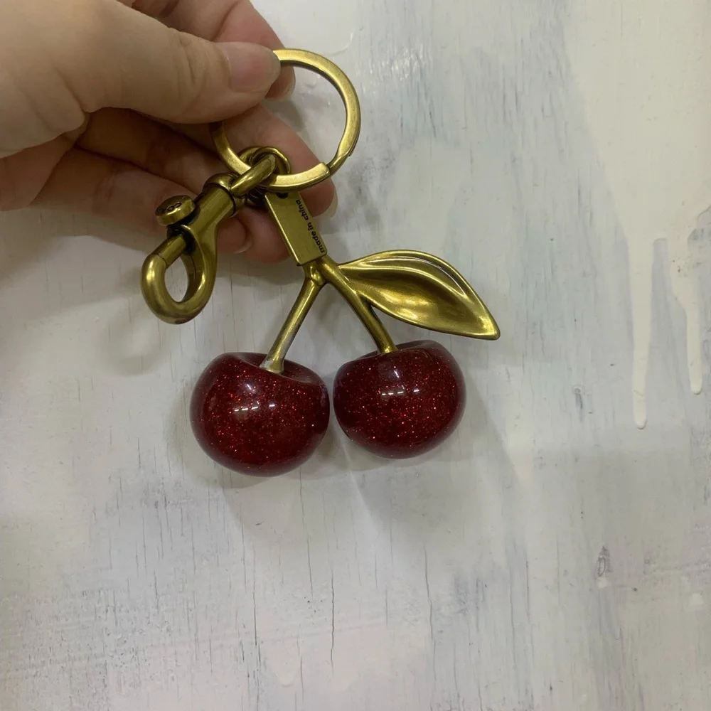 Coach Gold-Tone Glitter Cherry Key Charm in Red